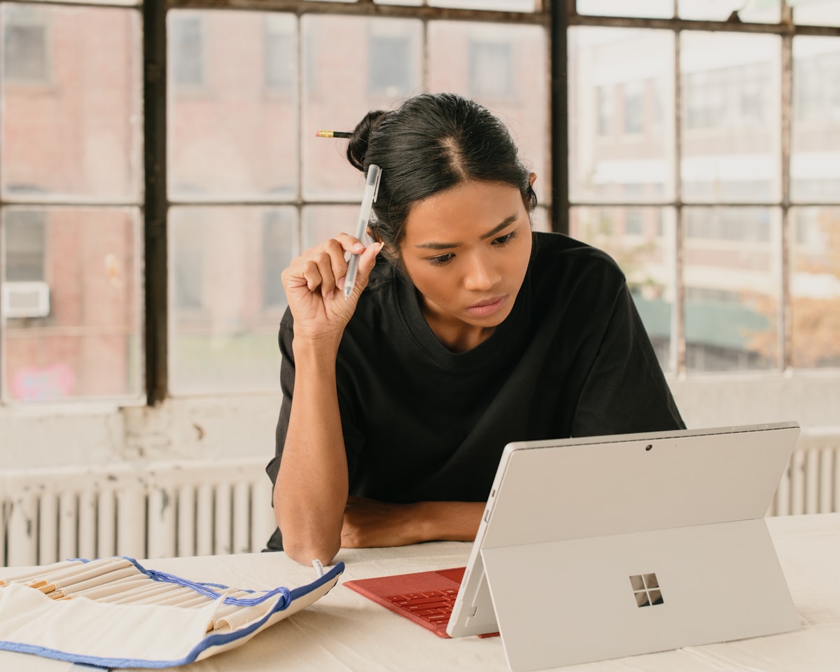 Student reviewing documents on a laptop